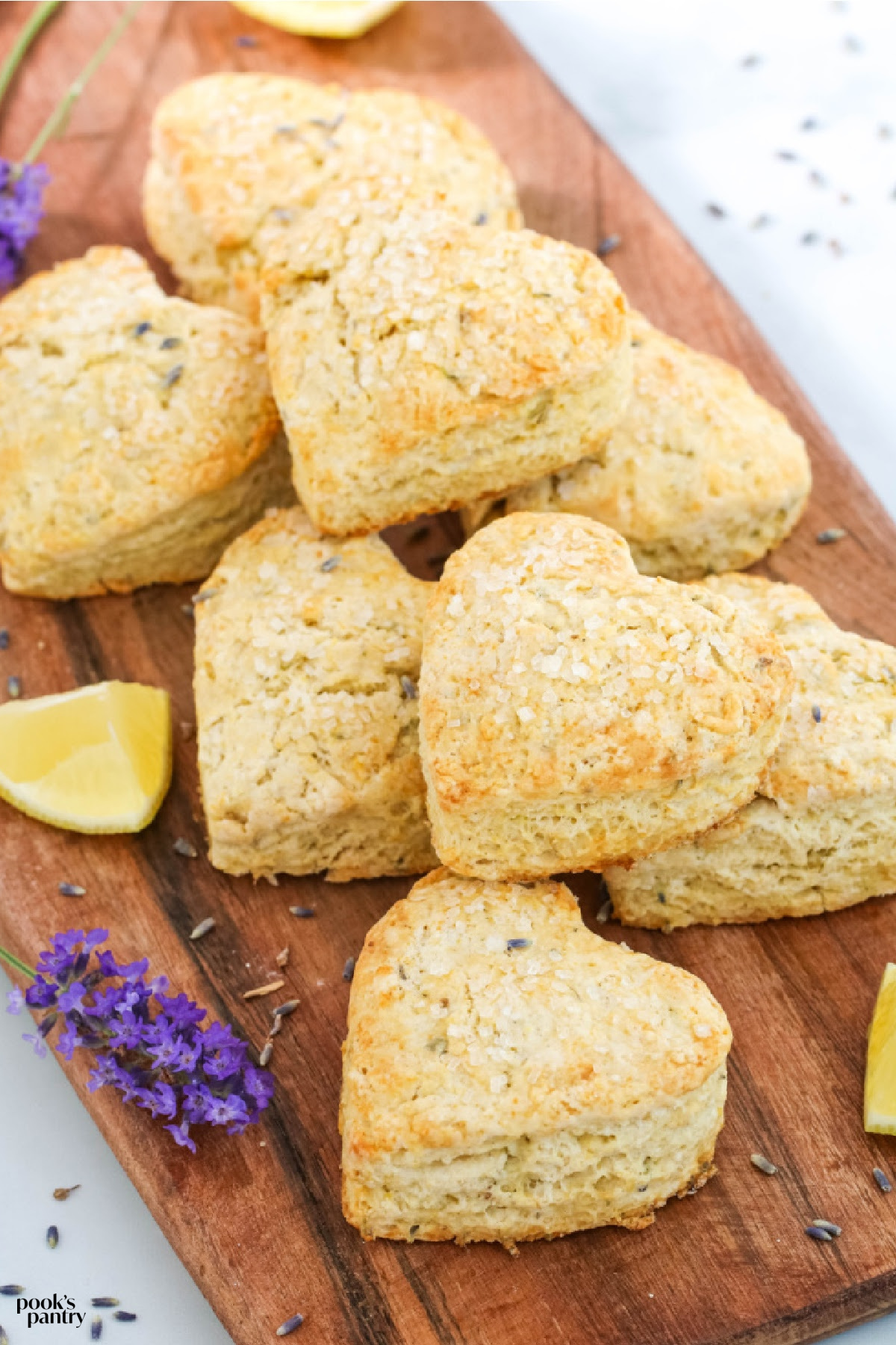 Lemon and lavender scones on wooden board.