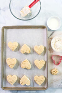 Cutting out heart-shaped scones.
