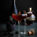 Chambord champagne cocktail on a dark background.