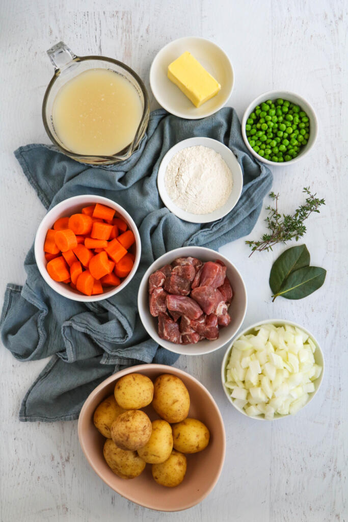 Ingredients for Irish lamb stew on white background.