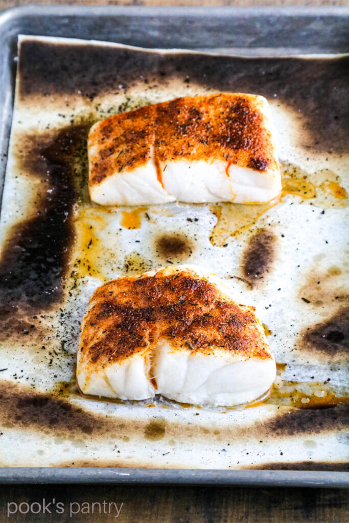 Broiled fish on sheet pan with Cajun spice.