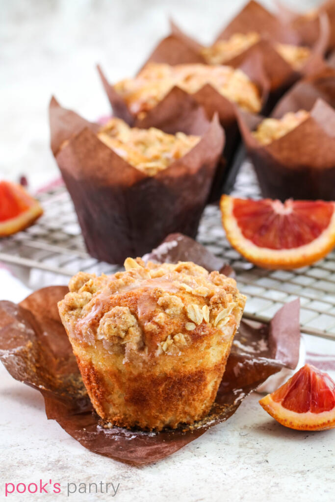 Orange muffins with crumb topping.