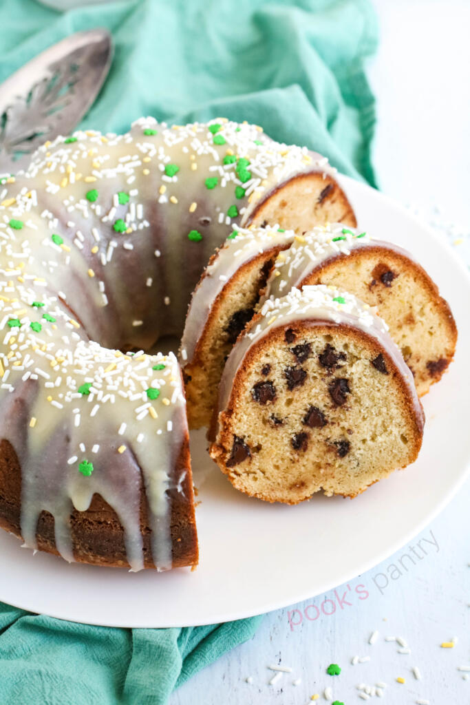 Slices of chocolate chip Bailey's Irish cream Bundt cake with serving knife.