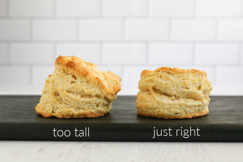 Two biscuits on wooden board.
