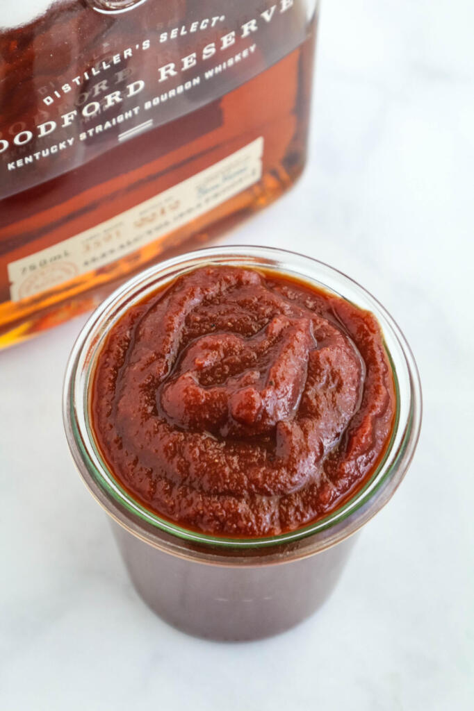 Bourbon BBQ sauce in glass jar.