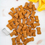 Banana pumpkin dog treats on a white background with a yellow towel.