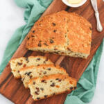 Sweet Irish soda bread on a wooden cutting board.