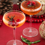 Cranberry wine spritzer recipe on a red background.