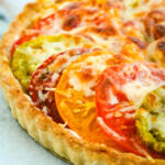 Baked tomato tart with cheese.