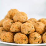 Plate of chicken meatballs on a white background.