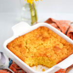 5 ingredient corn casserole in a square white baking dish.