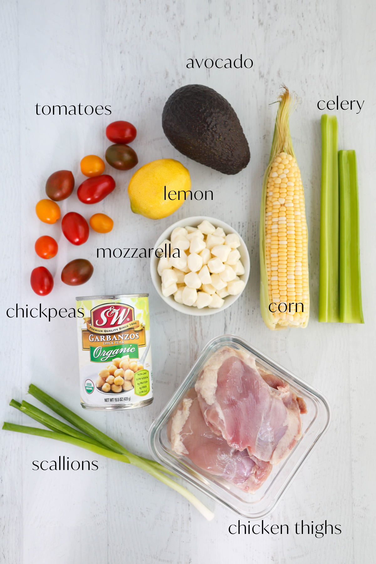 Ingredients for chicken salad on a light gray background.