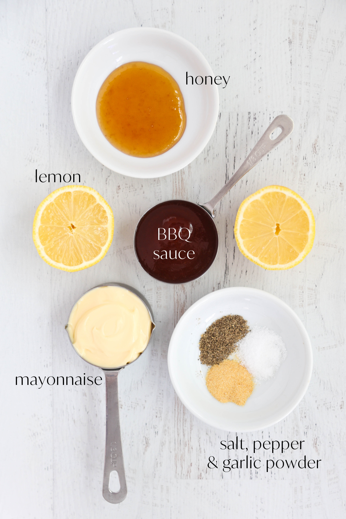 Ingredients for BBQ salad dressing on a light gray background.