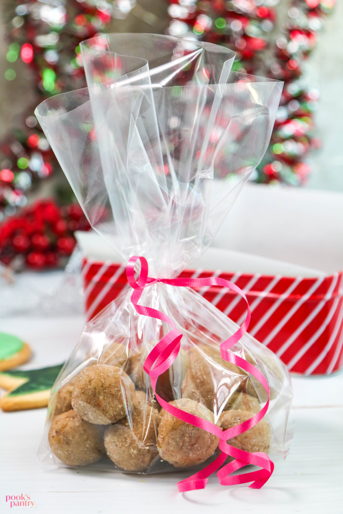 No bake rum balls wrapped in clear cellophane gift bags, ready to be packed into a box.