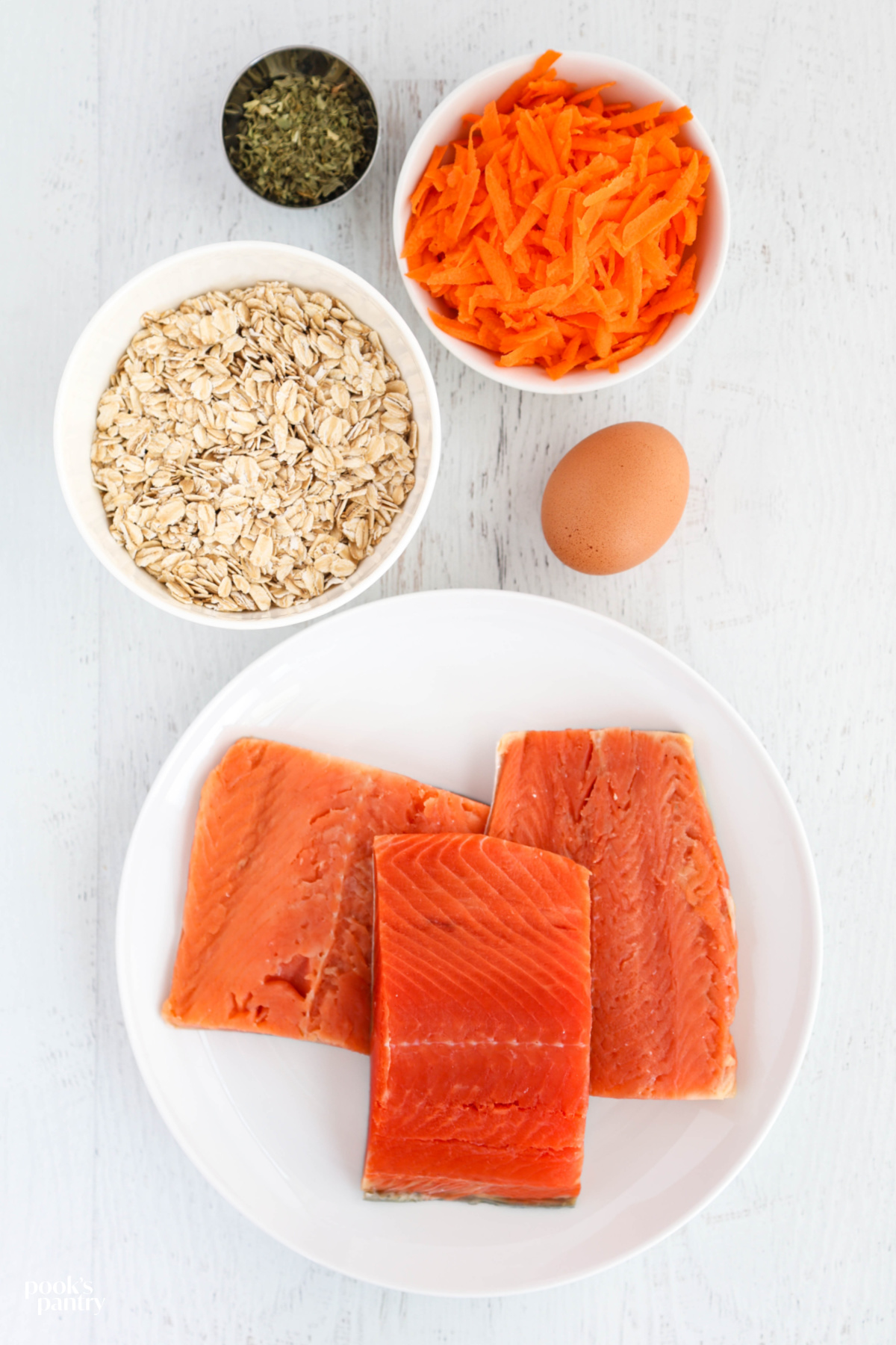Ingredients for meatballs on a white background.