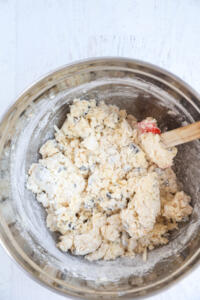 Adding currants and zest to flour.