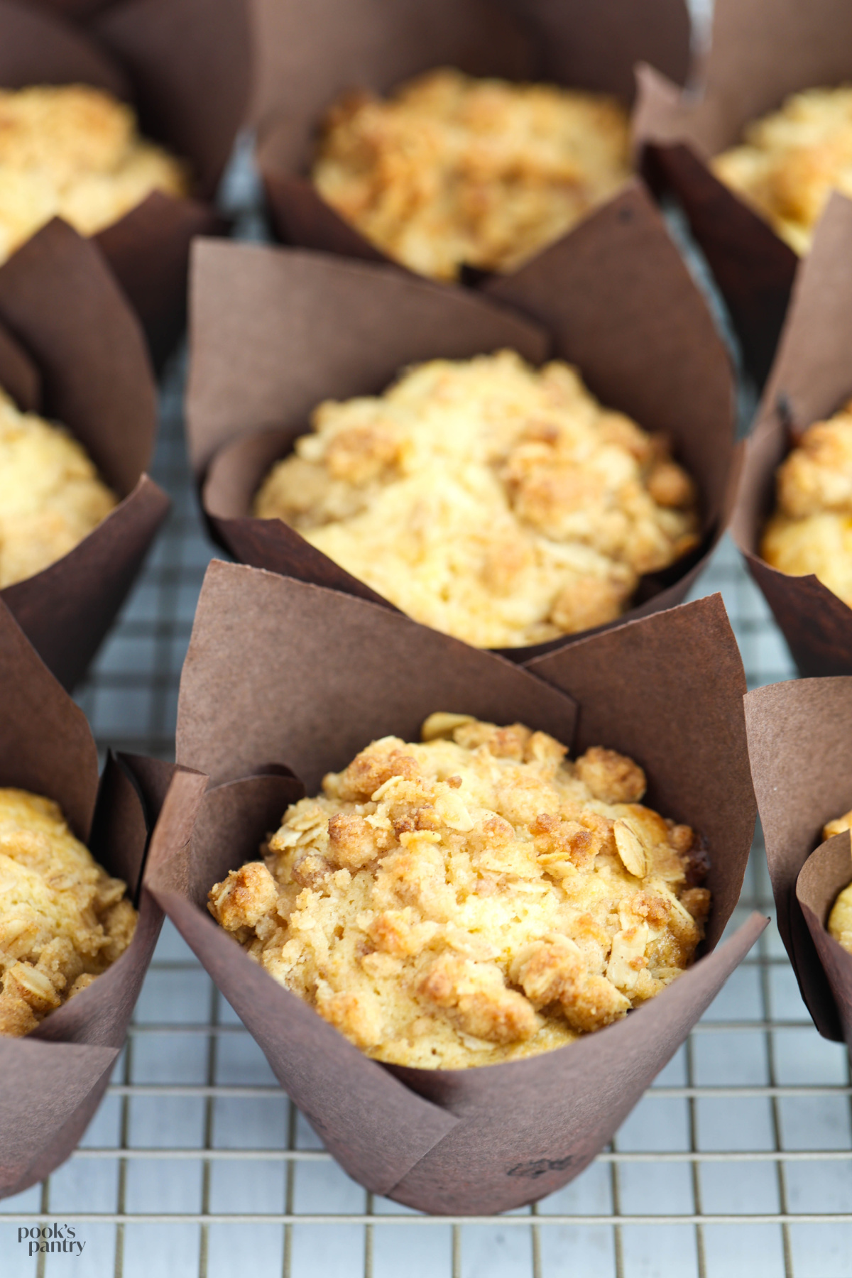 Muffins on a metal cooling rack.